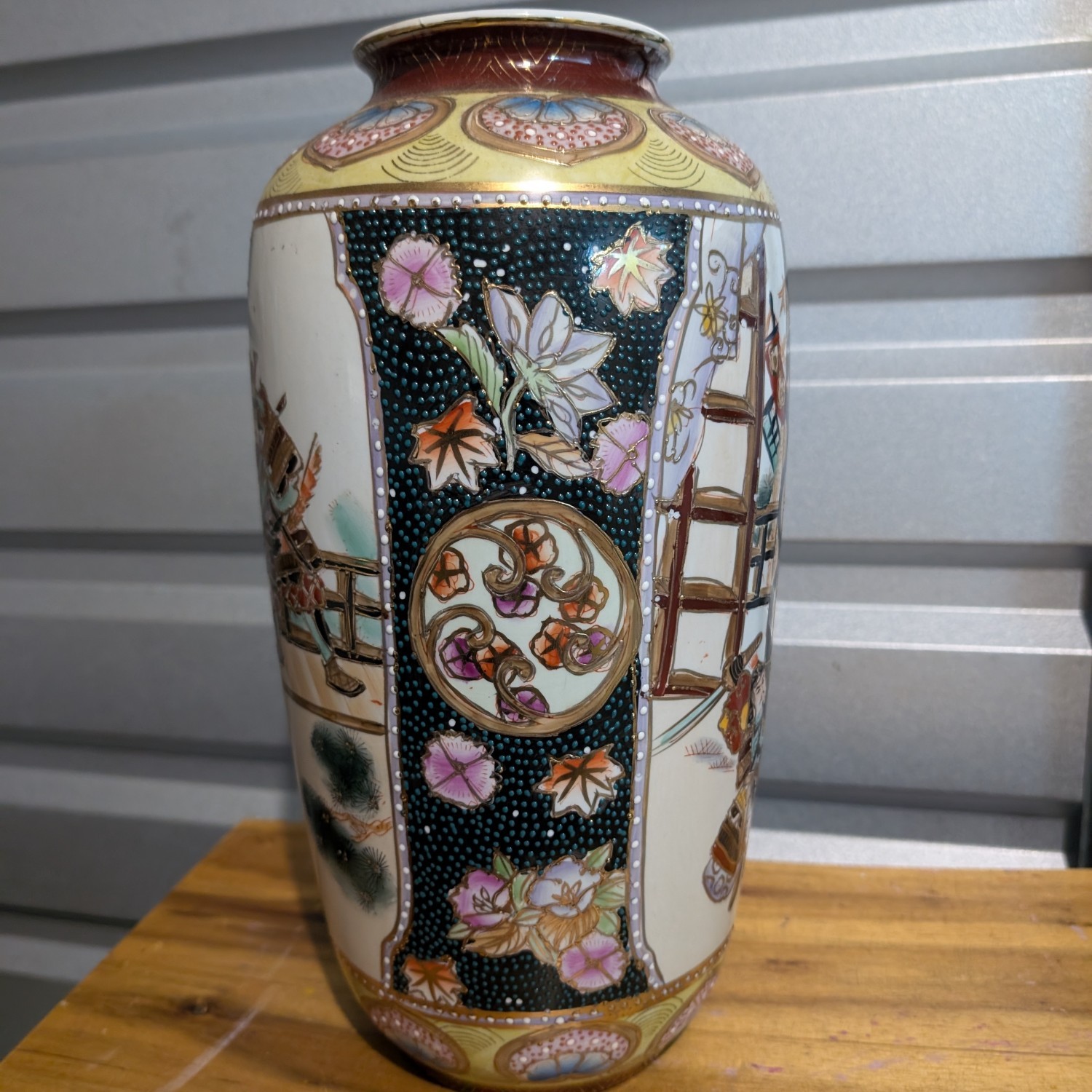 Vintage Japanese Satsuma vase ornate with samurai scene and flowers
