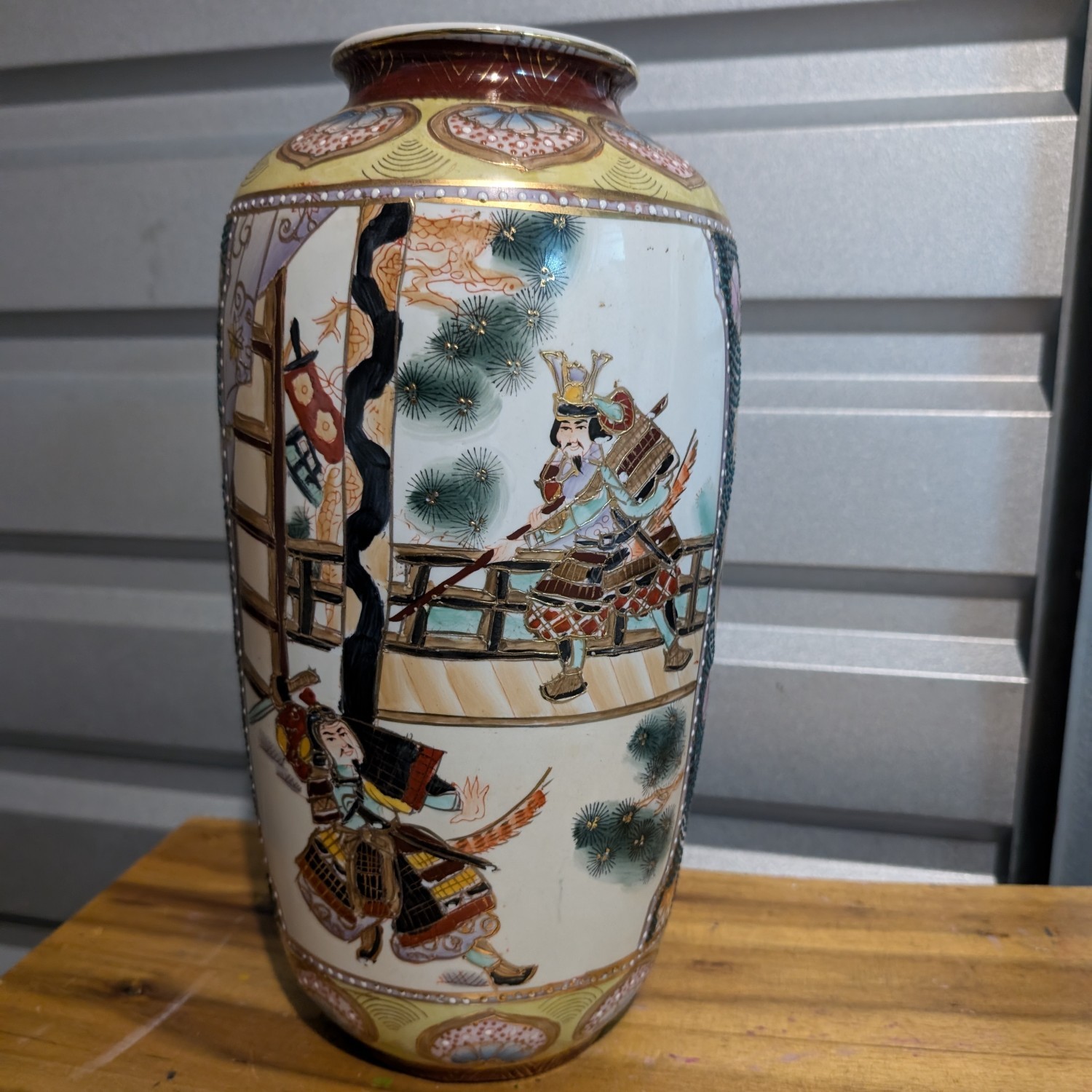 Vintage Japanese Satsuma vase ornate with samurai scene and flowers