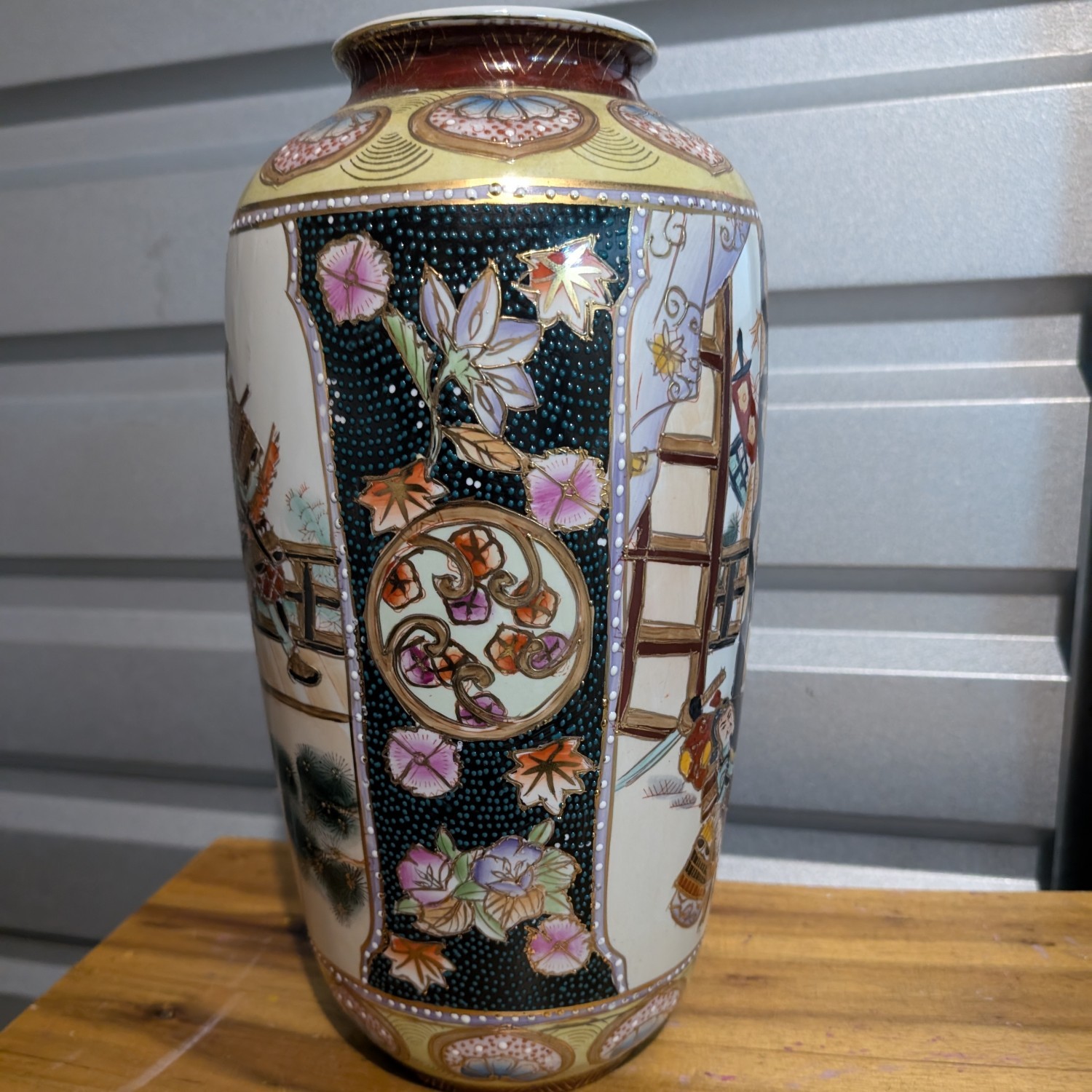 Vintage Japanese Satsuma vase ornate with samurai scene and flowers