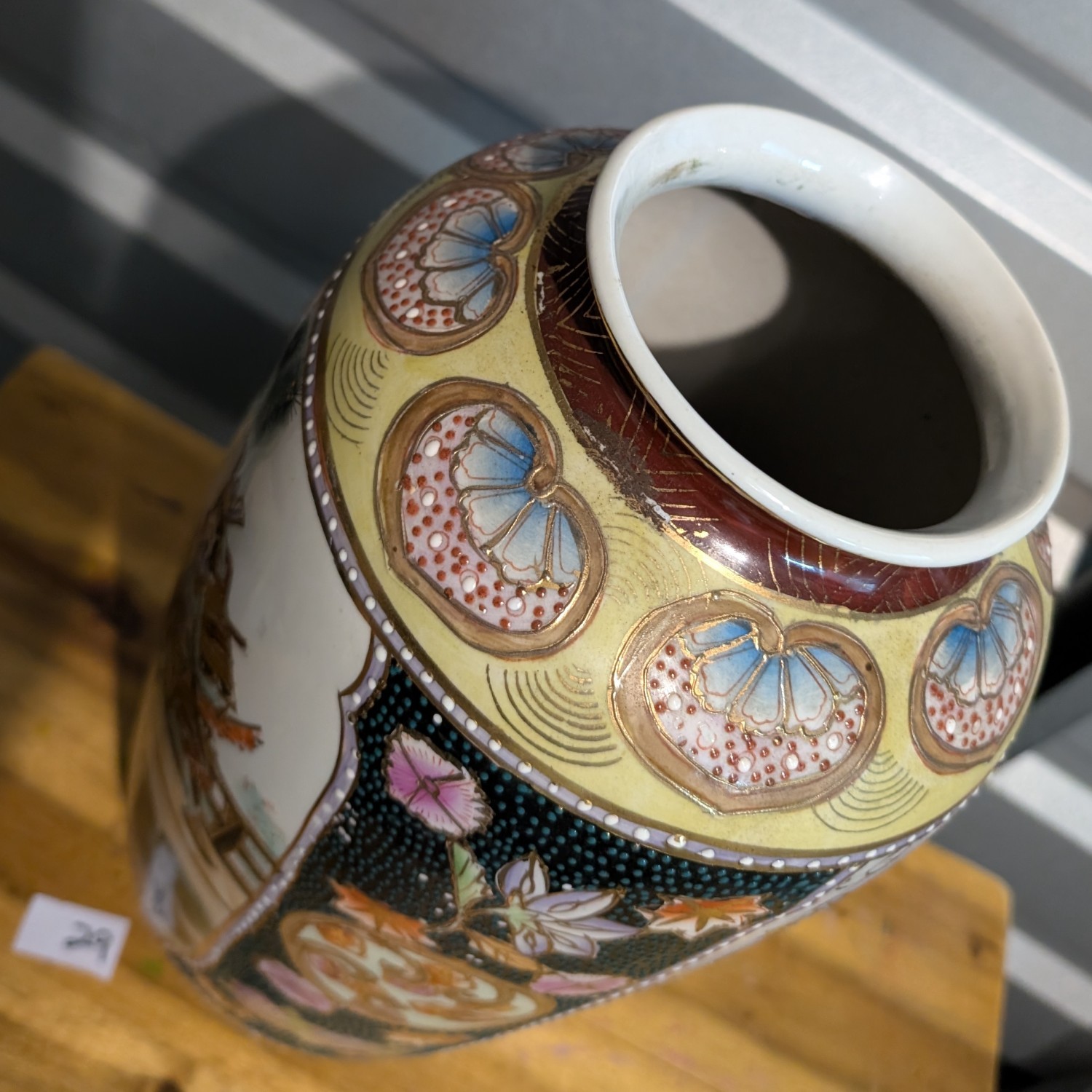 Vintage Japanese Satsuma vase ornate with samurai scene and flowers