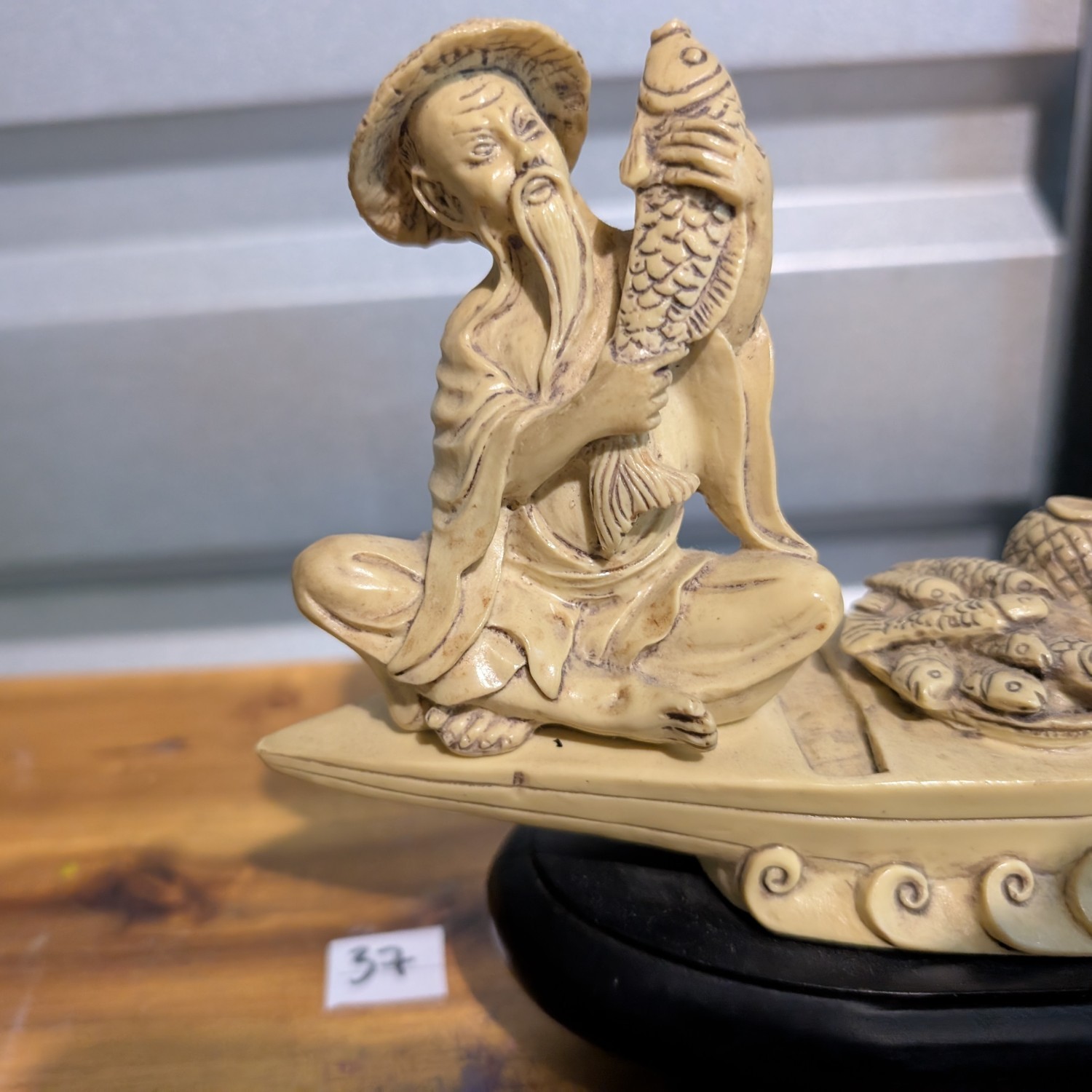 Chinese Men Fishing from a Boat Ivory-look Resin