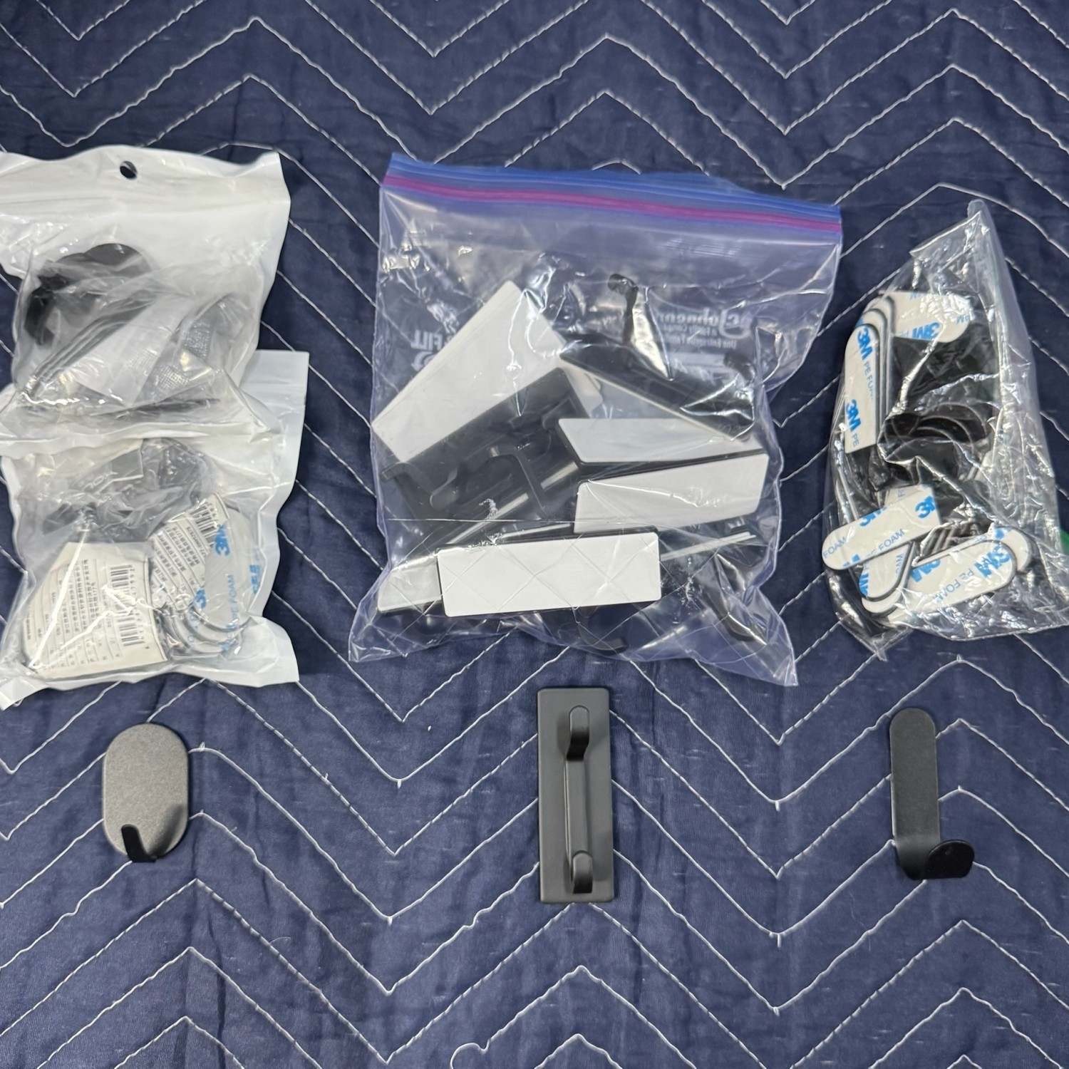 Various black metal sturdy hooks with adhesive or screws