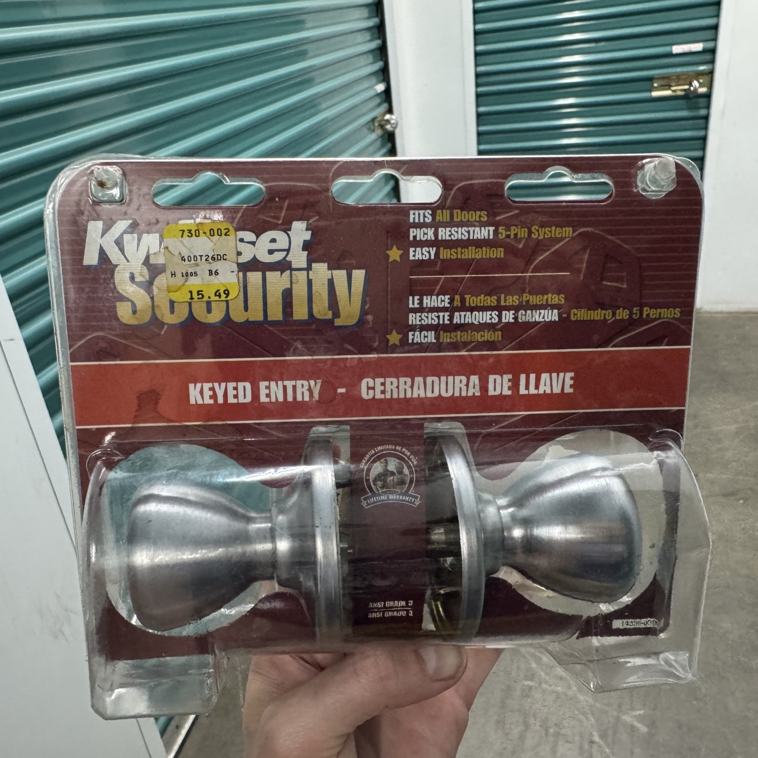 Brand New locking door knob - silver Kwikset