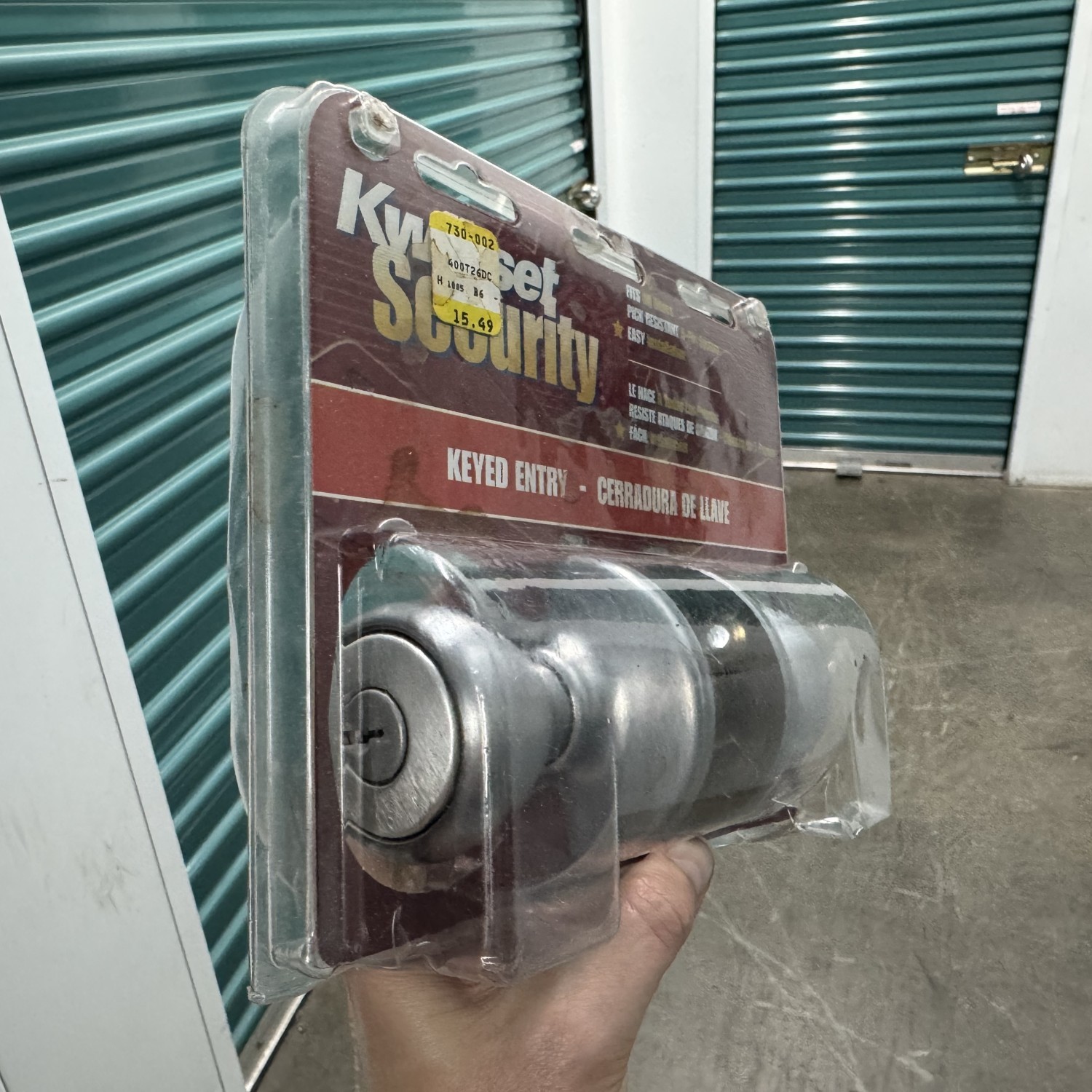 Brand New locking door knob - silver Kwikset