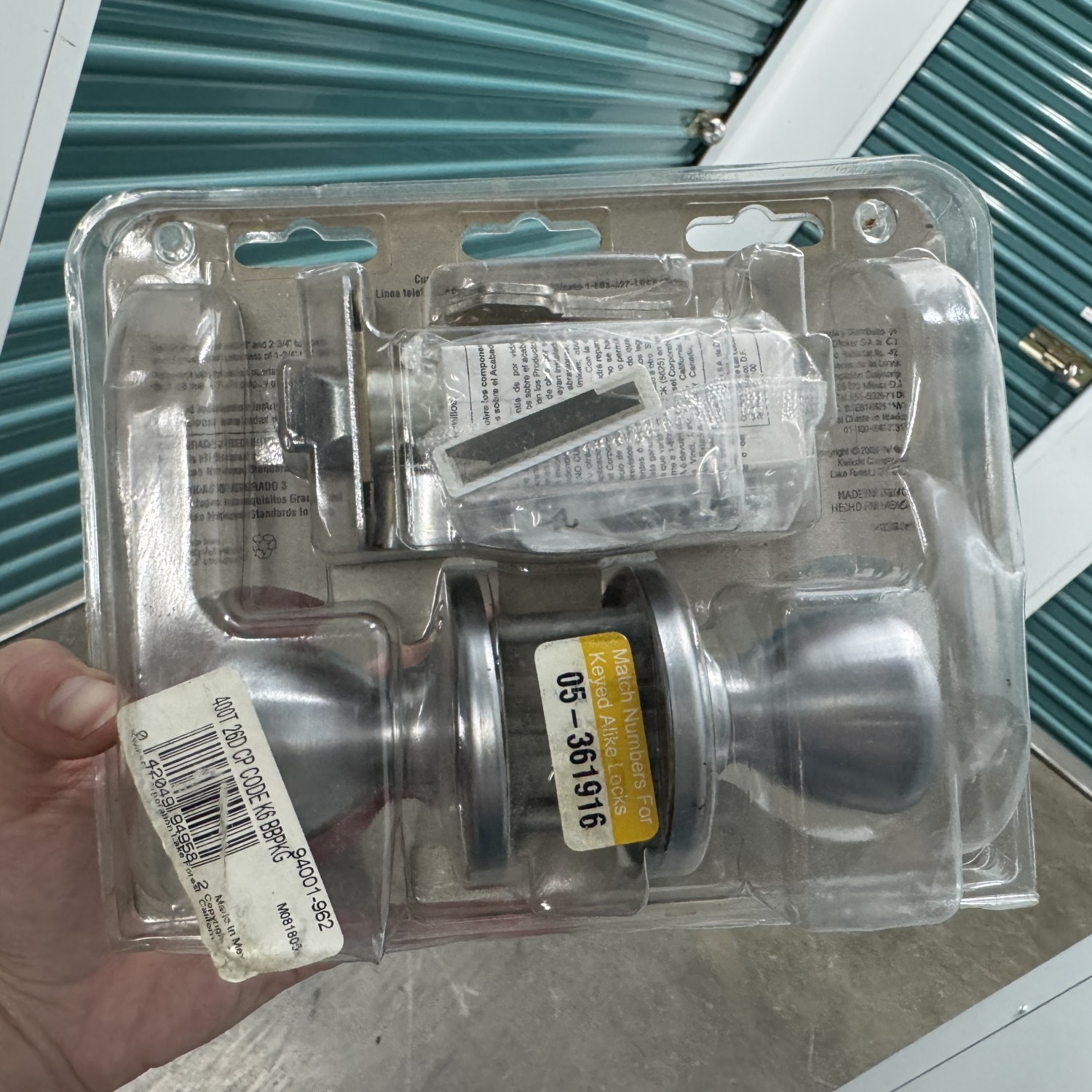 Brand New locking door knob - silver Kwikset