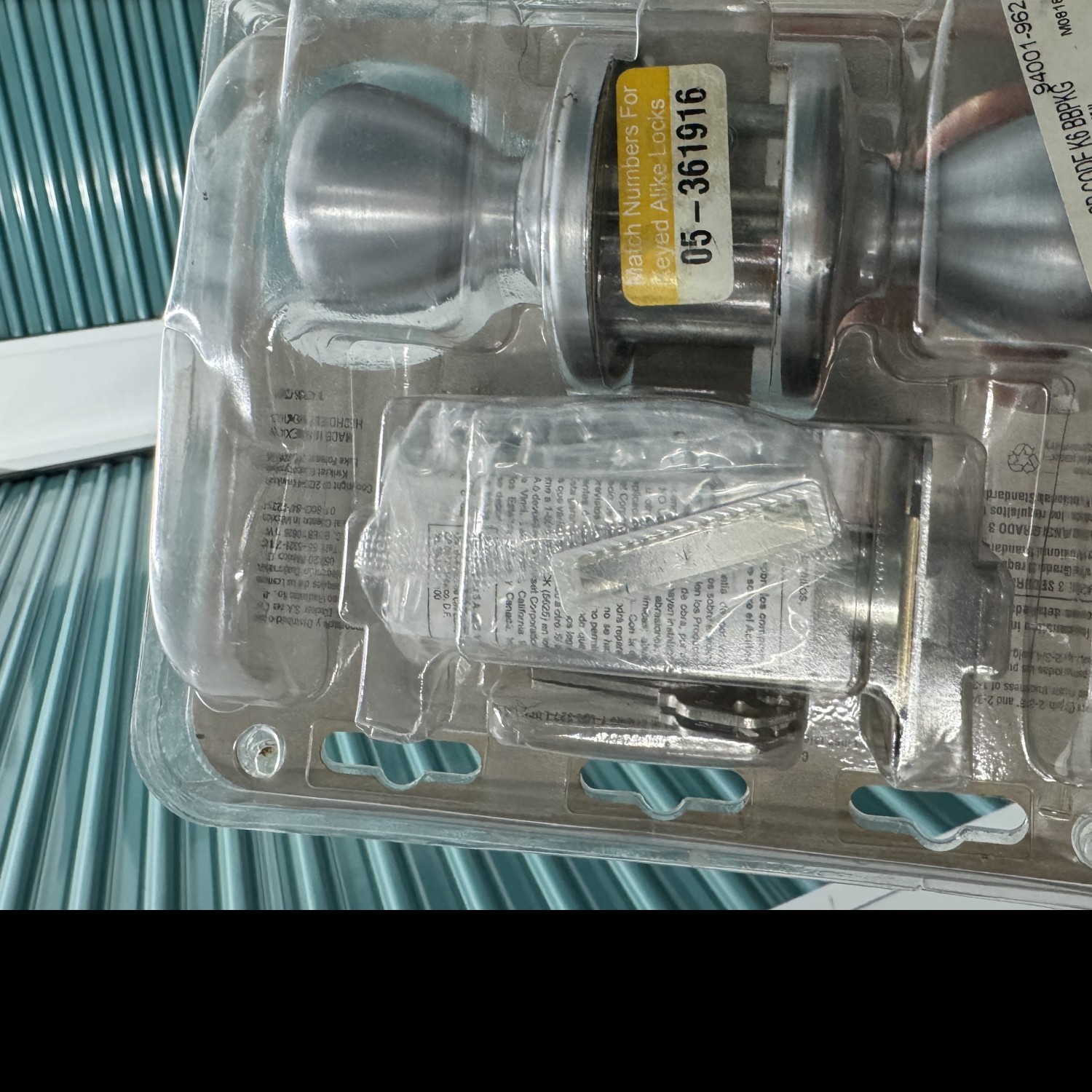 Brand New locking door knob - silver Kwikset
